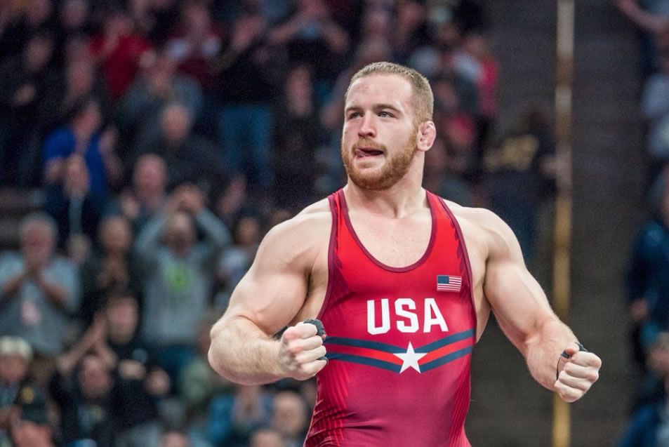 Wrestler celebrating victory in USA singlet