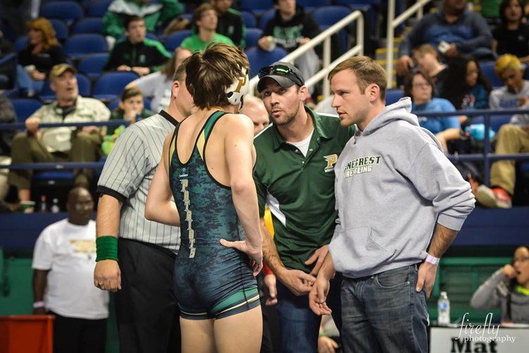 Wrestling team strategizes at tournament