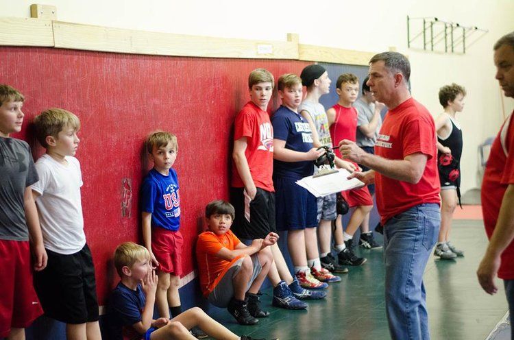 Group of boys listening to coach instructions